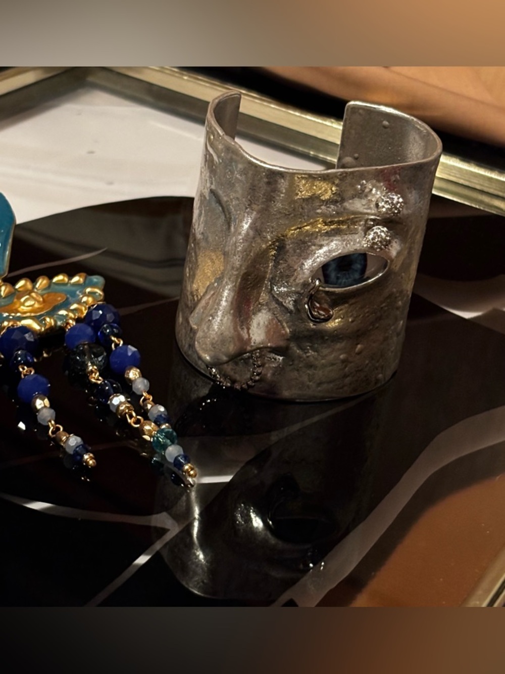 Artisan Schiaparelli Silver Face Cuff with Blue Eye Accent and Fanstar earrings